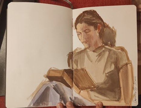 Carnet de croquis à la sépia tenu en main, Victoire de Verrières (image provisoire)